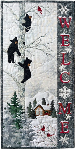 Three bears are watching in a tree above the cardinals, ready to welcome guests to the snowy winter lodge nestled in the foothills of the mountains
