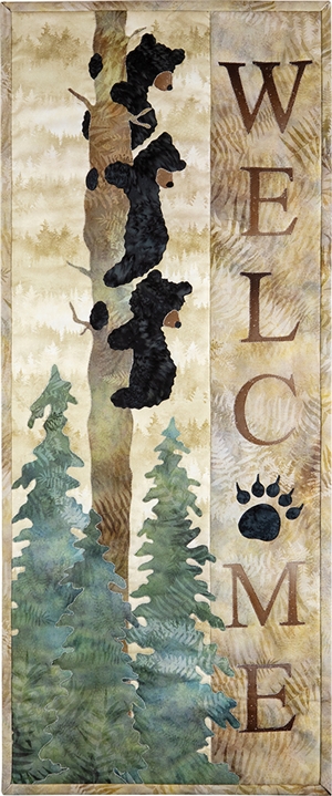 Three Bears hanging to a tree trunk overlook the words Welcome, a perfect quilt block for a cabin or woodland retreat