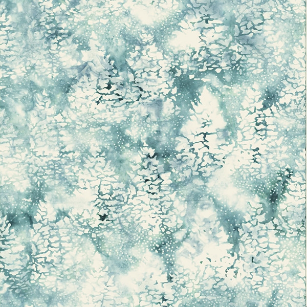 Batik fabric in snowy tree print in ice blue/green tones