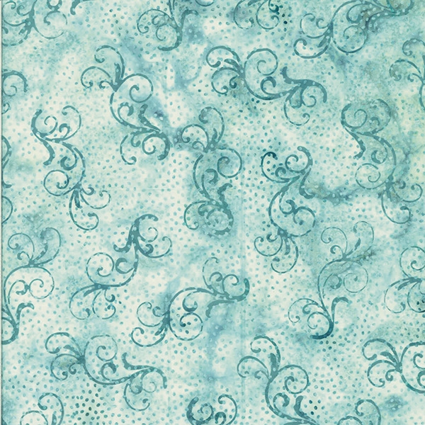 Batik fabric in a swirly, snow flurry print in blue/green tones