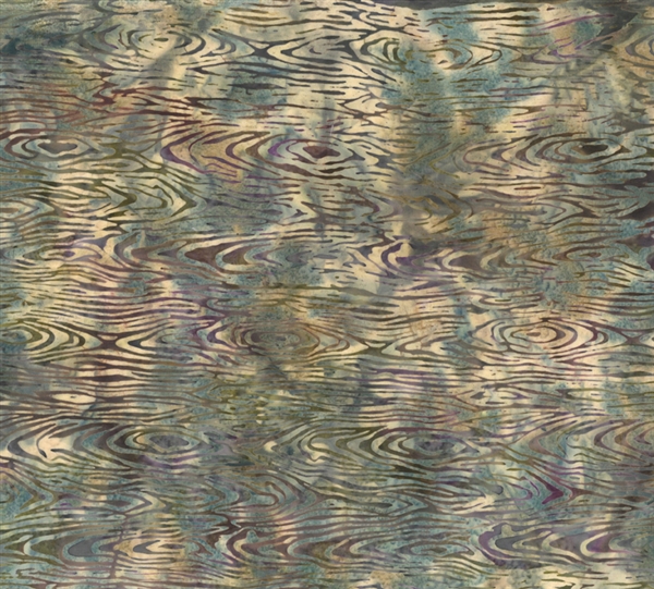 Batik fabric print of wood grain in neutral shades of cream, brown, purple and blue.