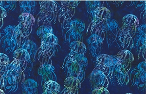 Batik fabric with a deep blue with bright green accents jellyfish print
