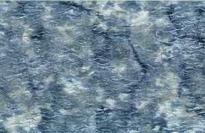 Batik fabric with an ocean wave print in denim blue