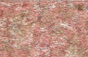 Batik fabric with an ocean wave print in pink and tan tones