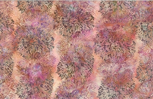Batik fabric with a sea anenome print in peach with pink and orange accents