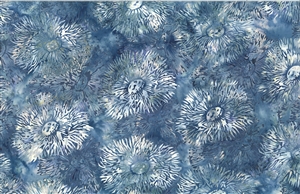 Batik fabric with a sea anenome print in denim blue