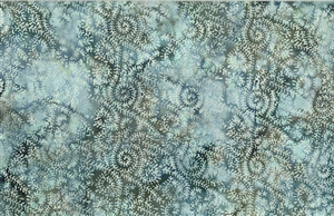 Batik fabric with a swirled seaweed print in light blue and olive green tones