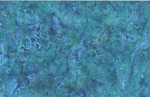 Batik fabric with a swirled water print in bright blue and green tones