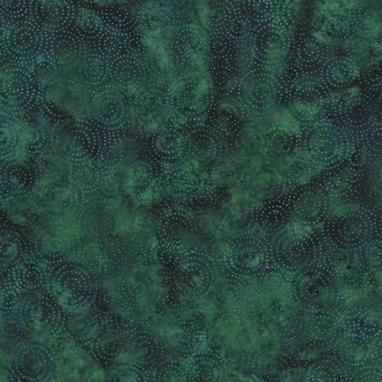 Spiral dot pattern batik fabric on a marbled dark green background.