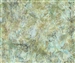 Kale texture batik fabric on a mottled moss green and light blue background.