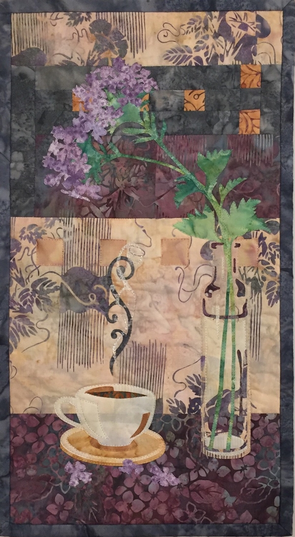 Quilt block of a steaming cup of coffee next to a vase to flowers.