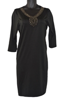 Black lady's plus size dress with an embellished neckline.
