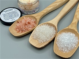 Close-up of Head Ease Bath Salts in a 120 ml jar surrounded by different salts.