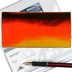 Lenticular checkbook cover with brown, yellow, and orange, color changing with