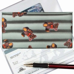 Lenticular checkbook cover with teddy bears on a black and white striped background, depth