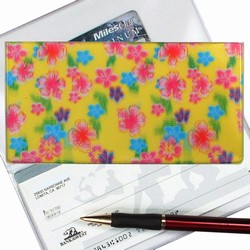 Lenticular checkbook cover with pink, blue, and green flowers on a yellow background, depth