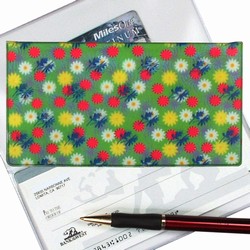 Lenticular checkbook cover with yellow, pink, and white flowers on a green background, depth