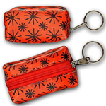 Lenticular purse key chain with red spinning wheels on white background, animation