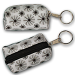 Lenticular purse key chain with black spinning wheels on white background, animation