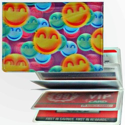 Lenticular credit card ID holder with large orange, green, and blue happy faces, depth