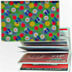 Lenticular credit card ID holder with yellow, pink, and white flowers on a green background, depth