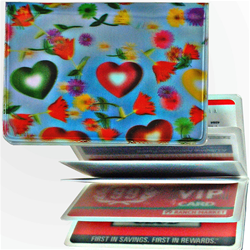 Lenticular credit card ID holder with multi colored hearts and flowers on a sky blue background, depth