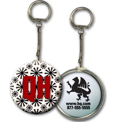Lenticular key chain with black spinning wheels on white background, animation