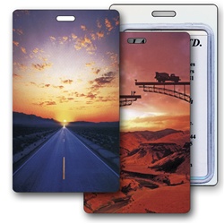 Lenticular luggage tag with serene open road in a desert changes to a bridge under construction in the sunset, flip