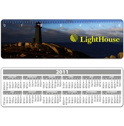 Lenticular ruler with lighthouse on a peninsula, casting a blinding light across the night sky onto the ocean for ship naviation, animation