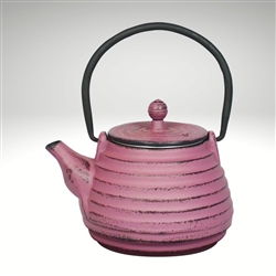 Image of the "Nabe" cast iron teapot by Ja by Frieling. This teapot has a lavender exterior with a textured surface.