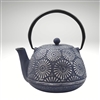 Image of the "Hani" cast iron teapot by Ja by Frieling. This teapot has a navy blue cast iron exterior with hand painted textured silver flower prints as a decorative surface.