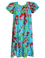 mud-calf muumuu dress with a vividly colored print containing hibiscus and bird of paradise flowers, surrounded by green foliage.