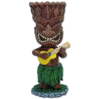 Miniature Ukulele Tiki that is spring loaded, playing a ukulele and wearing a hula skirt and sways near the skirt.