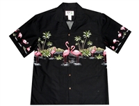 â€‹Black mens Aloha shirt with pink flamingos in a tropical setting with palm trees and volcano in the background.