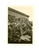 German Soldier Sitting on Pile of French Helmets, France 1940, Original WW2 Photo