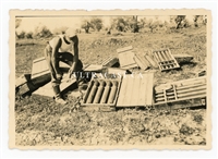 German Soldier Inspects Captured Russian Ammunition and Crates, Original WW2 Photo