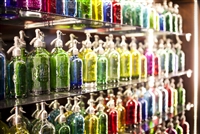 Wall of 108 Seltzers | The Seltzer Shop | Colored Argentine seltzer bottle - vintage seltzer pendant light - wine chiller interior design elements