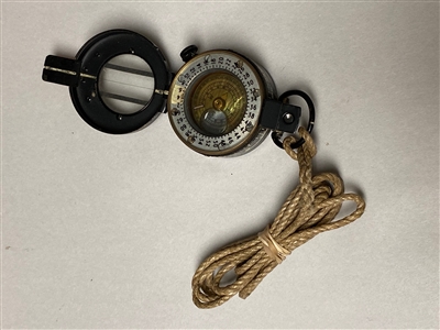 BRITISH MILITARY COMPASS WITH LANYARD.