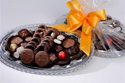 Artisan Chocolates beautifully arranged on an elegant silver platter. 
â€‹ Choose one or two pound size.