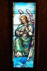 Angel with Lilly Flower, Antique Stained Glass Window By J&R Lamb Studios.