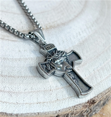 stainless steel cross pendant on a stainless steel chain