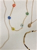 Four different Mirajo Jewelry necklaces including  becoming flower necklace on light background