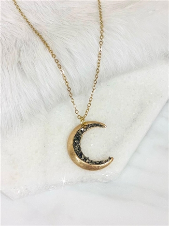 Moon child necklace on white background