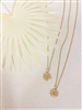 Two Mirajo Jewelry wildflower necklaces on white cloth