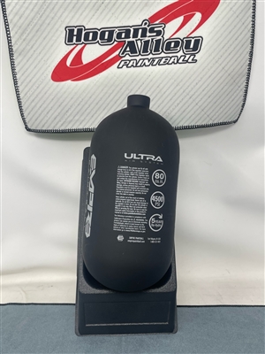 An Empire Ultra 80ci 4500psi carbon fiber HPA tank. The tank is black with white accents.