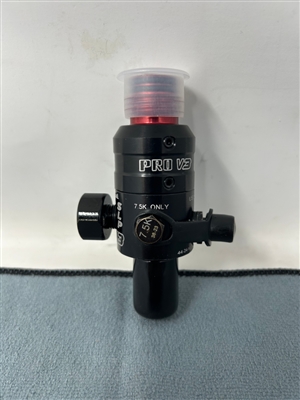 A Ninja Pro V3 4500psi tank regulator with red aluminum bonnet. The reg has an SLP output pressure.