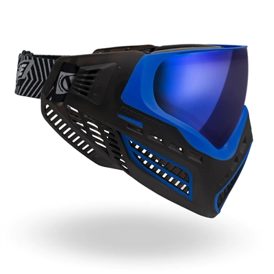 A Virtue VIO Ascend paintball mask in the Blue Ice colorway. The goggle is black with blue accents, and comes with an Ice mirrored thermal lens.
