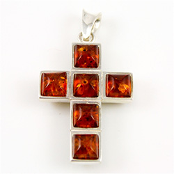This is a two sided amber cross.  Green one one side and honey colored on the reverse.