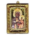 Hand painted and decorated glass blown icon ornament is enhanced with glitter and a gold finish. The back and sides are finished in a gold and silvered frame. The back has a white window inscribed with "Our Lady of Czestochowa" This exquisite icon ornamen