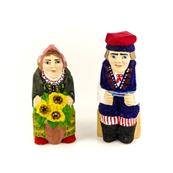 Hand carved and painted by folk artist Tadeusz Lesniak this unique pair is sitting with a vase of popular Sun Flowers!  Hand made so not two pairs are exactly alike.